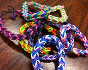 Pencil and paper aren't the only ways to create art. A growing artistic fad at my school is bracelet making, specifically bracelets made with small colorful rubber-bands. These handcrafted bracelets are designed and created per request by several of my students, and for many are great ways to show individuality, support of a sports team, or pride by wearing their native country’s colors.
